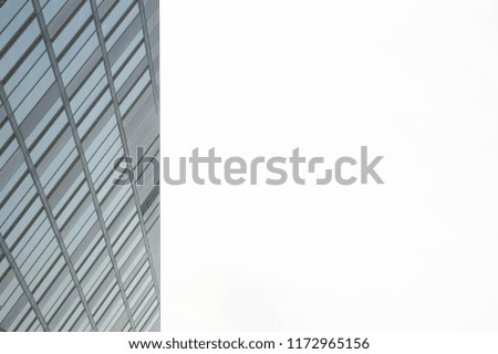 Minimalist background image, architectural building shot upward into the sky.