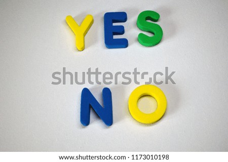 YES NO written from colorful 3D foam letters on white background