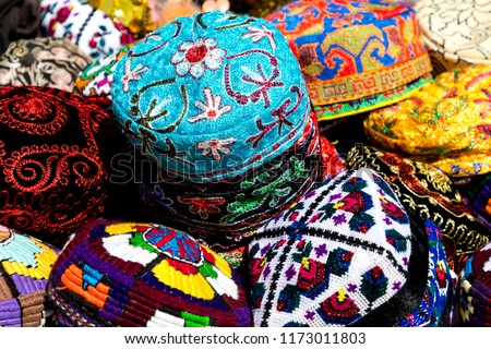 The traditional Uzbek cap named tubeteika, decorated with multi colored embroidery. Bukhara, Uzbekistan, Central Asia Royalty-Free Stock Photo #1173011803