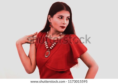 Photo of red dressed , classy and elegant Indian girl.