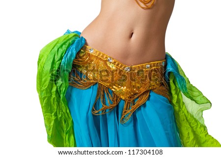Close up shot of a belly dancer wearing a blue, gold and green costume shaking her hips. Isolated on white. Clipping path included so image can be easily transferred to a different colored background. Royalty-Free Stock Photo #117304108