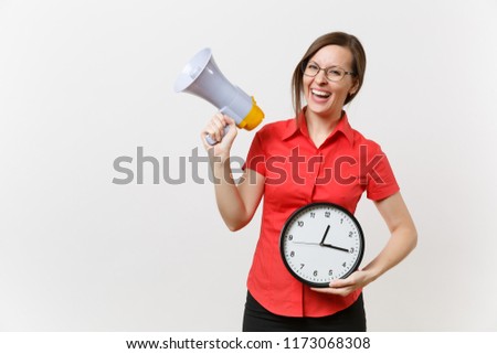 Portrait of young happy business teacher woman in red shirt holding round clock, scream in megaphone, announces discounts sale, isolated on white background. Hot news, communication concept. Hurry up