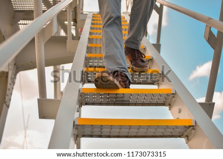 the man descends the steps
