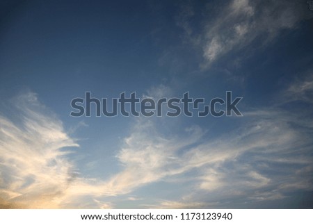 Sunset has created a good background for soaring clouds in the clear sky they are very different and the wind dispersed them all over the endless space