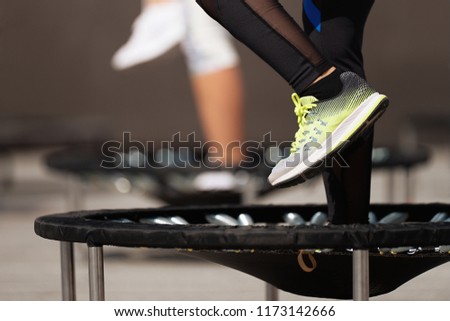 Fitness women jumping on small trampolines,exercise on rebounder Royalty-Free Stock Photo #1173142666