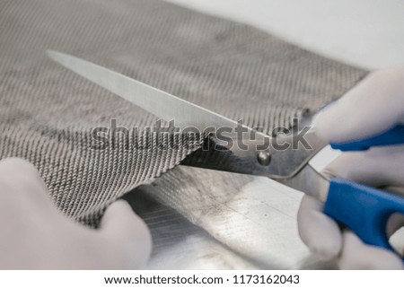 Cutting Carbon fiber composite material with sharp scissors