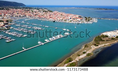 Aerial drone bird's eye view photo from popular Marina full of yachts and sail boats in Lefkada city waterfront, Ionian, Greece