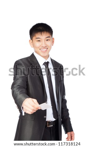 Handsome young asian business man hold empty visit or credit business card, businessman happy smile, wear elegant suit and tie isolated over white background