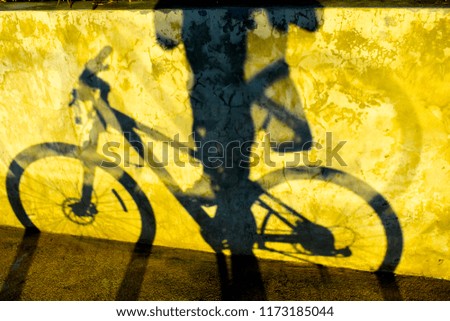 abstract bicycle shadow on concrete wall as background