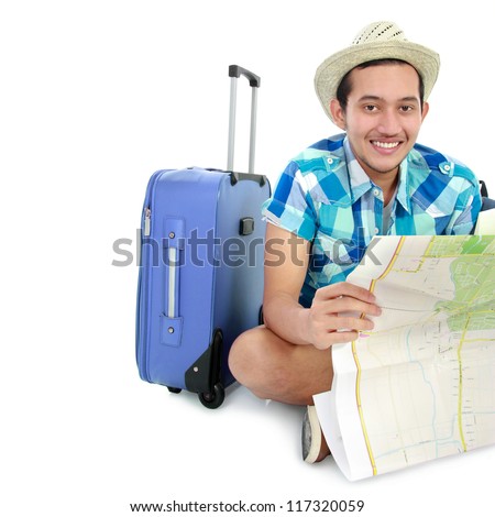 Attractive Asian tourist man looking at the map isolated on white background