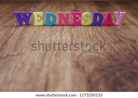 wednesday alphabet letter with space copy on wooden background