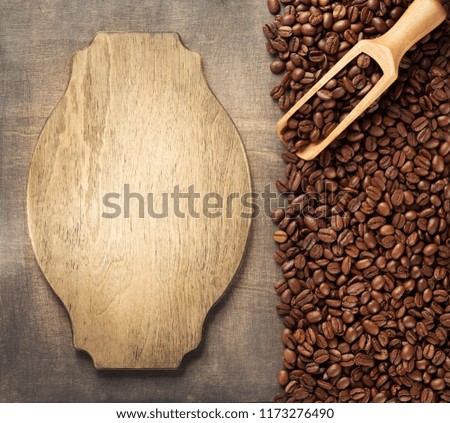 coffee concept, beans and sign board on wooden background, top view