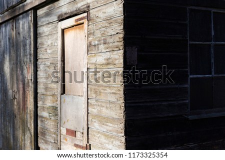 Closed door of a wooden house.