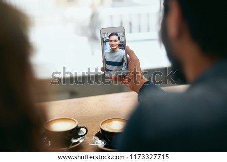 Video Calling On Phone. Hand With Phone And Face On Screen. Close Up Of People Using Smartphone For Video Call. High Resolution