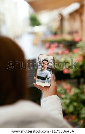 Video Call On Phone. Close Up Hand With Phone And Face On Screen. Woman Calling Man Via Online Video Chat. High Resolution