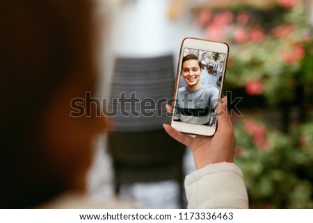 Video Call On Phone. Close Up Hand With Phone And Face On Screen. Woman Calling Man Via Online Video Chat. High Resolution