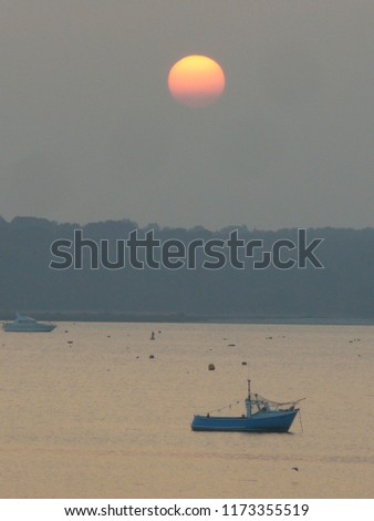 orange sun over Poole harbour