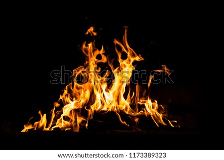 Fire flames isolated on black background. High resolution wood fire flames collection smoke texture background concept image.