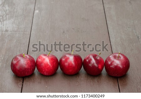 Red apples on a wooden table