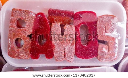 Edible letters in a Sweet Candy Decorated Text Written Baños city of Ecuador known by Traditional Confectionery and Souvenir Handicraft 
Market. 