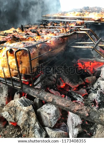 The process of cooking meat on fire, grill
