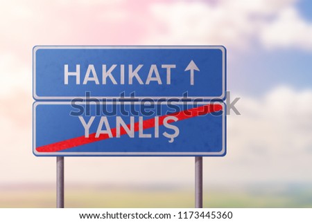truth and false - blue road sign with inscriptions in Turkish