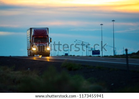 Semi truck at dusk Royalty-Free Stock Photo #1173455941