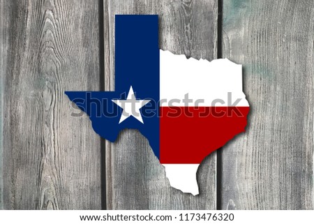 USA Texas flag background, with Texas map filled with Texas flag on wood background