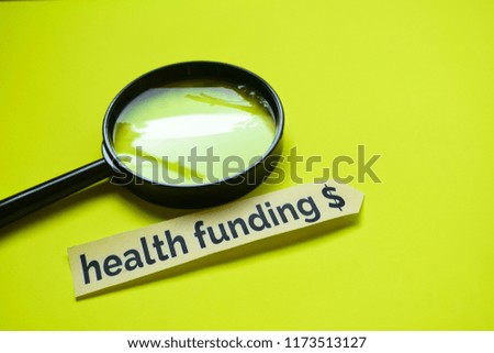 Health Funding $ with Magnifying glass concept inspiration on yellow background