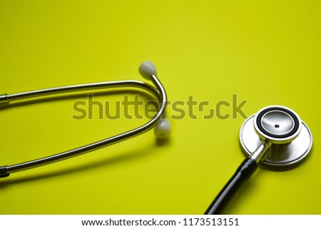 stethoscope with healthcare concept inspiration on yellow background