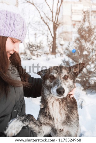 Woman with her dog outdoor.