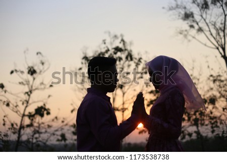 love couple romantic hold hands. Young couple in love on the sunset.