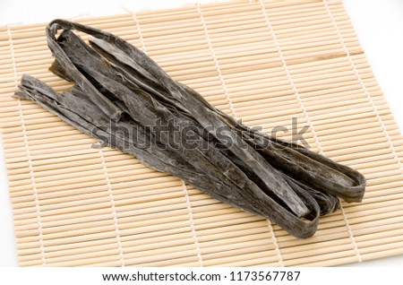 Dried kombu seaweed Japanese dry kelp on bamboo mat