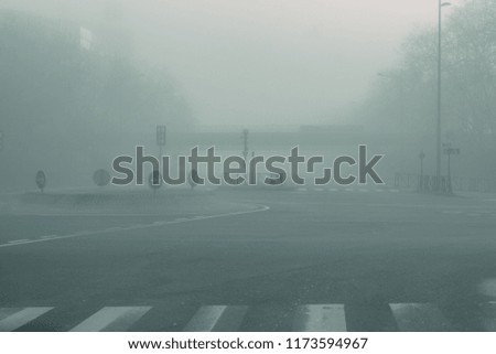 City road intersection roundabout in mist fog. Misty magic concept wallpaper.
