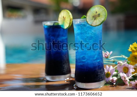 blue hawaiian cocktail in swimming pool