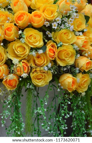 Yellow plastic roses used to decorate the place