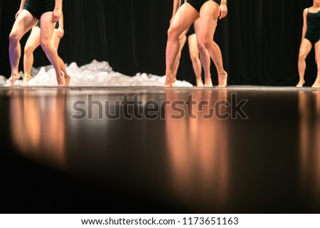 Legs of ballet dancers on stage in theater