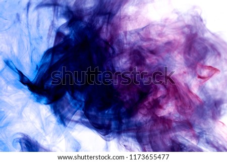 Dense blue and purple smoke on a white isolated background. Background of smoke vape