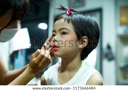 Portrait Asian girl having make up on her face