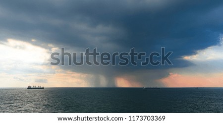 Tropical thunderstorm at anchorage of Vung Tau, Vietnam in Mekong river delta