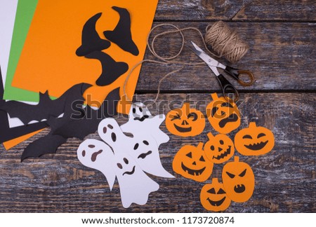 The set of materials for creative handmade ornament on a wooden table. Decoration for autumn holiday Halloween. Flay lay