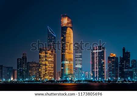 City night view of Abu Dhabi business financial district. United Arab Emirates, middle east. Luxury lifestyle. 