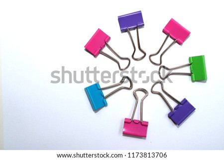 Colorful office paper clips on a white background