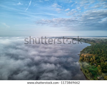 Sunset and fog on the Volga River near the city of Ulyanovsk. Russia. View of the city.