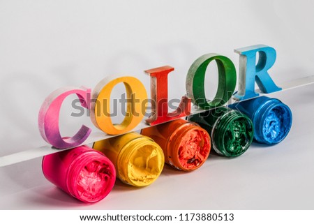 the colorful word color put on screen printing ink glass bottles in white background with copy space
