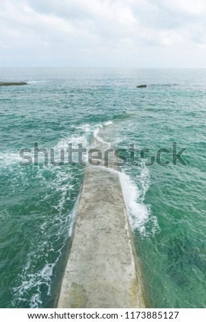 detail of artificial breakwater made of concrete in the Cantabrian Sea, Spain