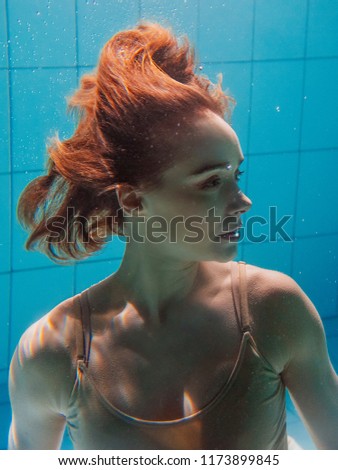 portrait of athletic sport woman underwater in the swimming pool