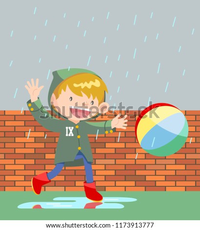 boy playing ball under rain