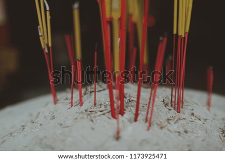 Incense burning in pagoda. Royalty high quality free stock image of incenses burning in garden with blur background. Close focus of incense with copy space for text or advertising