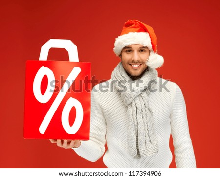 bright picture of handsome man in christmas hat .